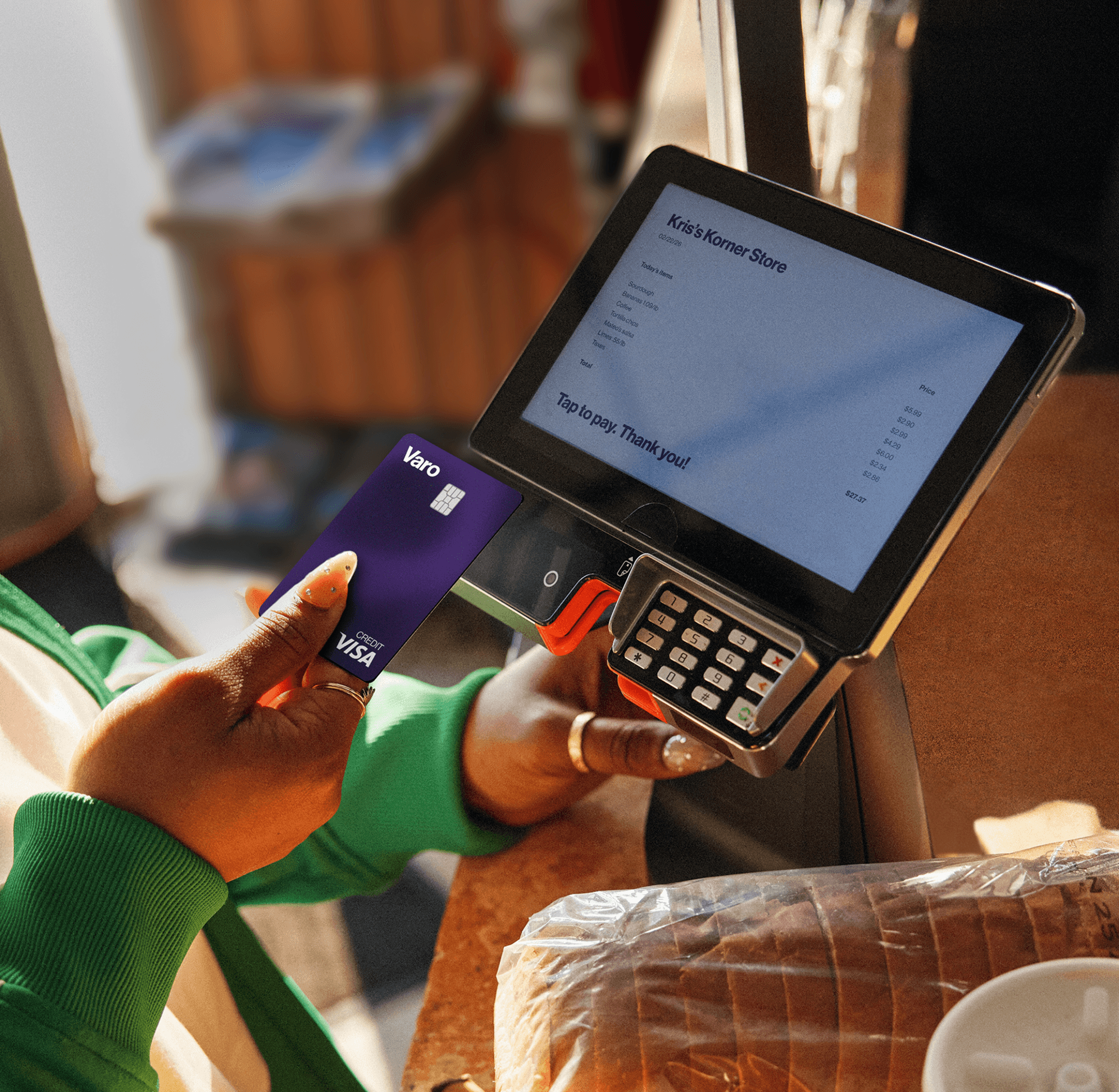 dark purple believe credit card being used at POS kris's korner store